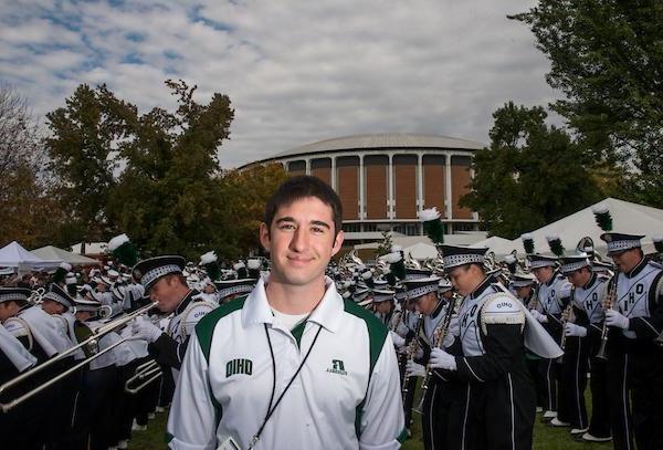 Gary Dillabaugh III poses for a portrait beside the Marching 110 performance during the Miami vs. 露天橄榄球比赛的车尾派对.  摄影:Elizabeth Held